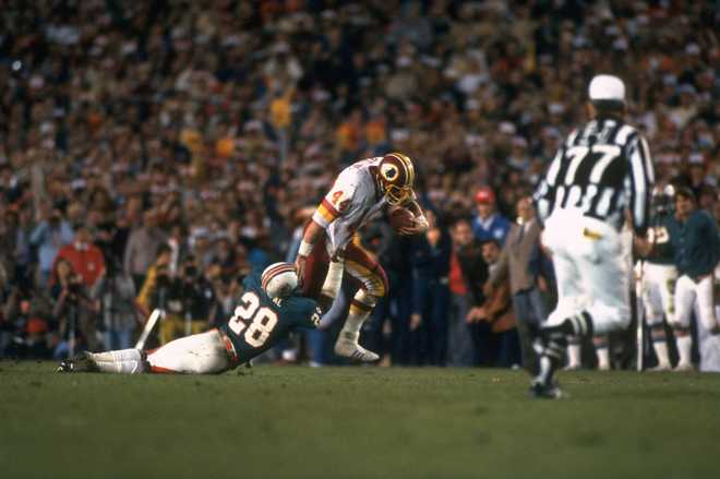 Football: Super Bowl XVII: Washington Redskins John Riggins (44) in action, rushing for 43-yard touchdown vs Miami Dolphins Don McNeal (28) at Rose Bowl Stadium.
Pasadena, CA 1/30/1983
CREDIT: Andy Hayt (Photo by Andy Hayt /Sports Illustrated via Getty Images)
(Set Number: X27986 )