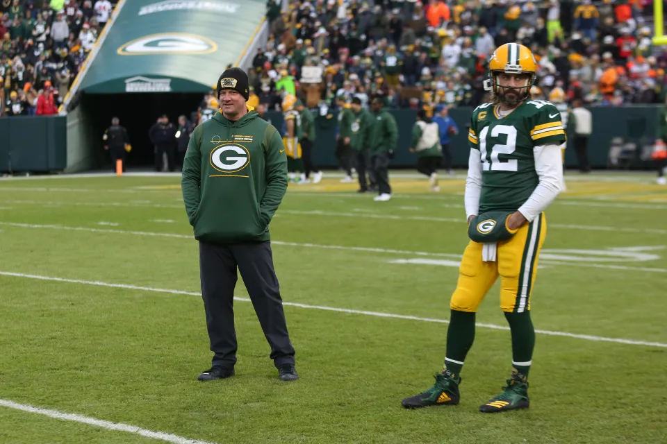 Green Bay Packers Offensive Coordinator Nathaniel Hackett looks on as Green Bay Packers quarterback Aaron Rodgers