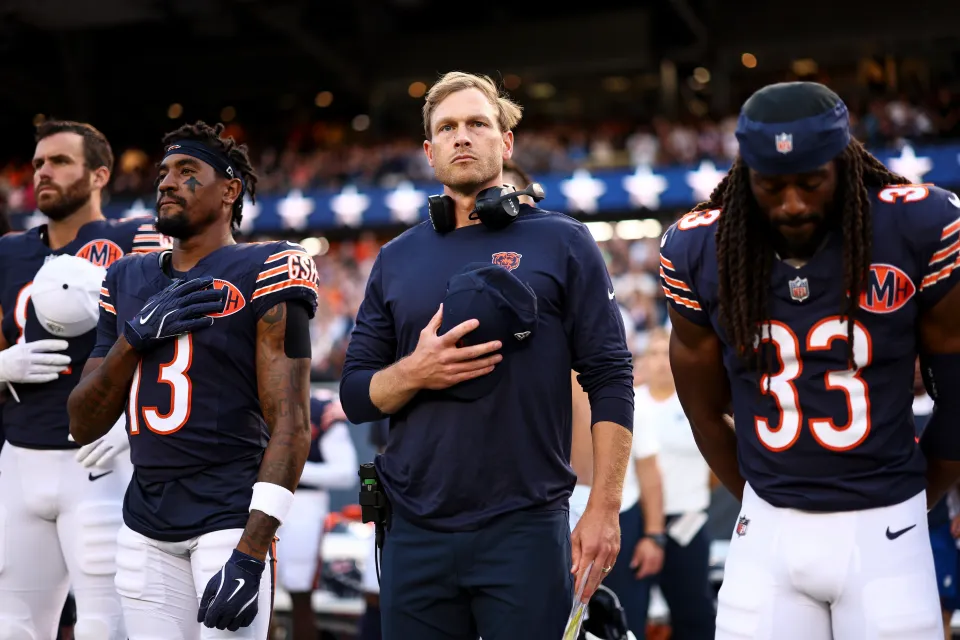 Head coach Ben Johnson of the Chicago Bears stands on the sidelines during the national anthem prior to an NFL Preseason 2025 game against the Buffalo Bills