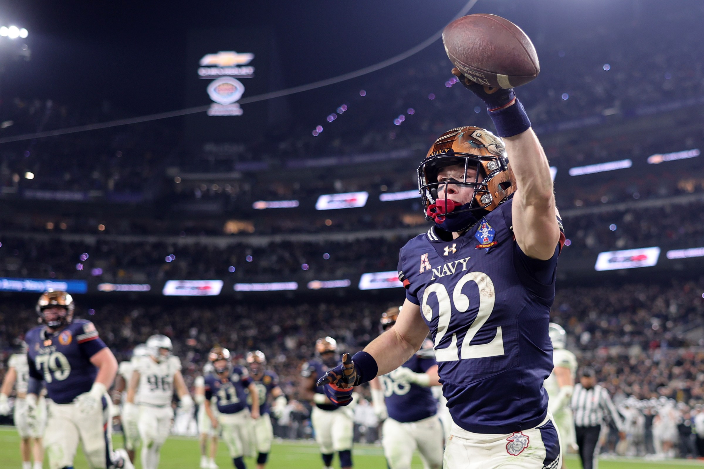 Dec 13, 2025; Baltimore, Maryland, USA; Navy Midshipmen wide receiver Eli Heidenreich (22) reacts after scoring a touchdown against the Army Black Knights during the second half at M&T Bank Stadium. Mandatory Credit: Mike Dinovo-Imagn Images