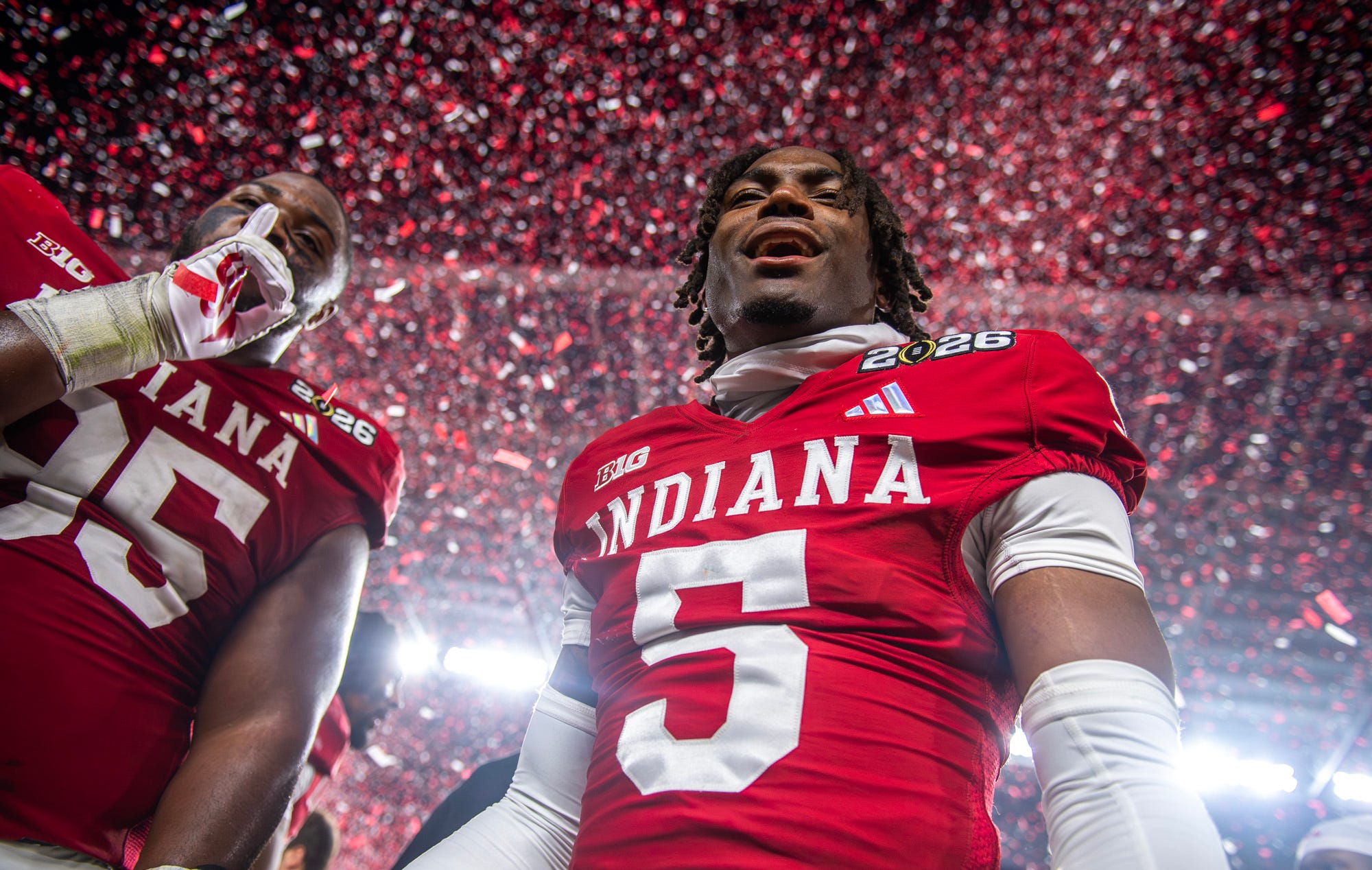 Indiana’s D’Angelo Ponds (5) and Tyrique Tucker (95) celebrate after the College Football Playoff National Championship college football game at Hard Rock Stadium in Miami Gardens on Monday, Jan. 19, 2026.