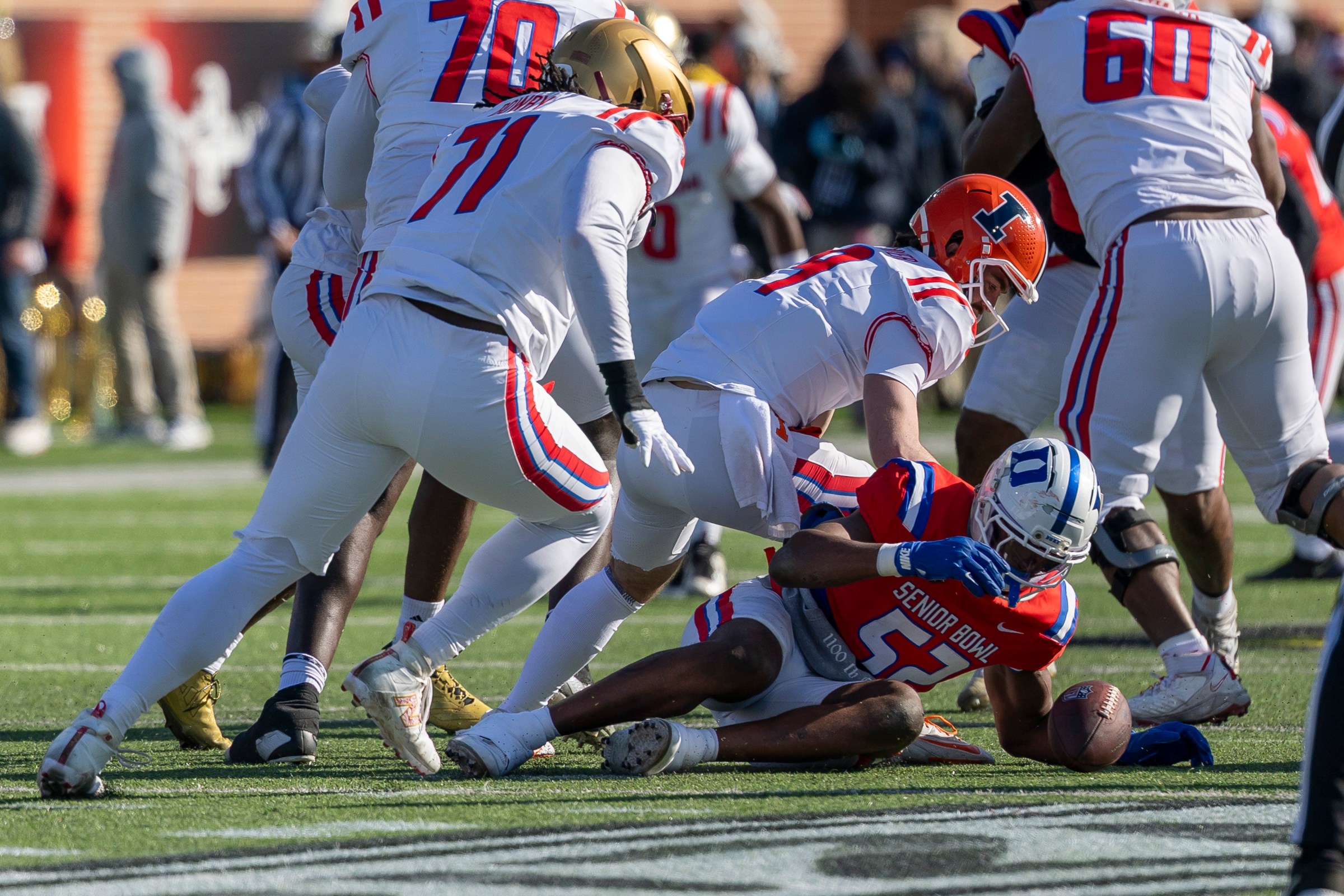 Jan 31, 2026; Mobile, AL, USA; National defensive end Vincent Anthony Jr (52) of Duke strip sacks American quarterback Luke Altmyer (9) of Illinois and recovers the fumble during the first half of the 2026 Senior Bowl at University of South Alabama, Hancock Whitney Stadium. Mandatory Credit: Vasha Hunt-Imagn Images