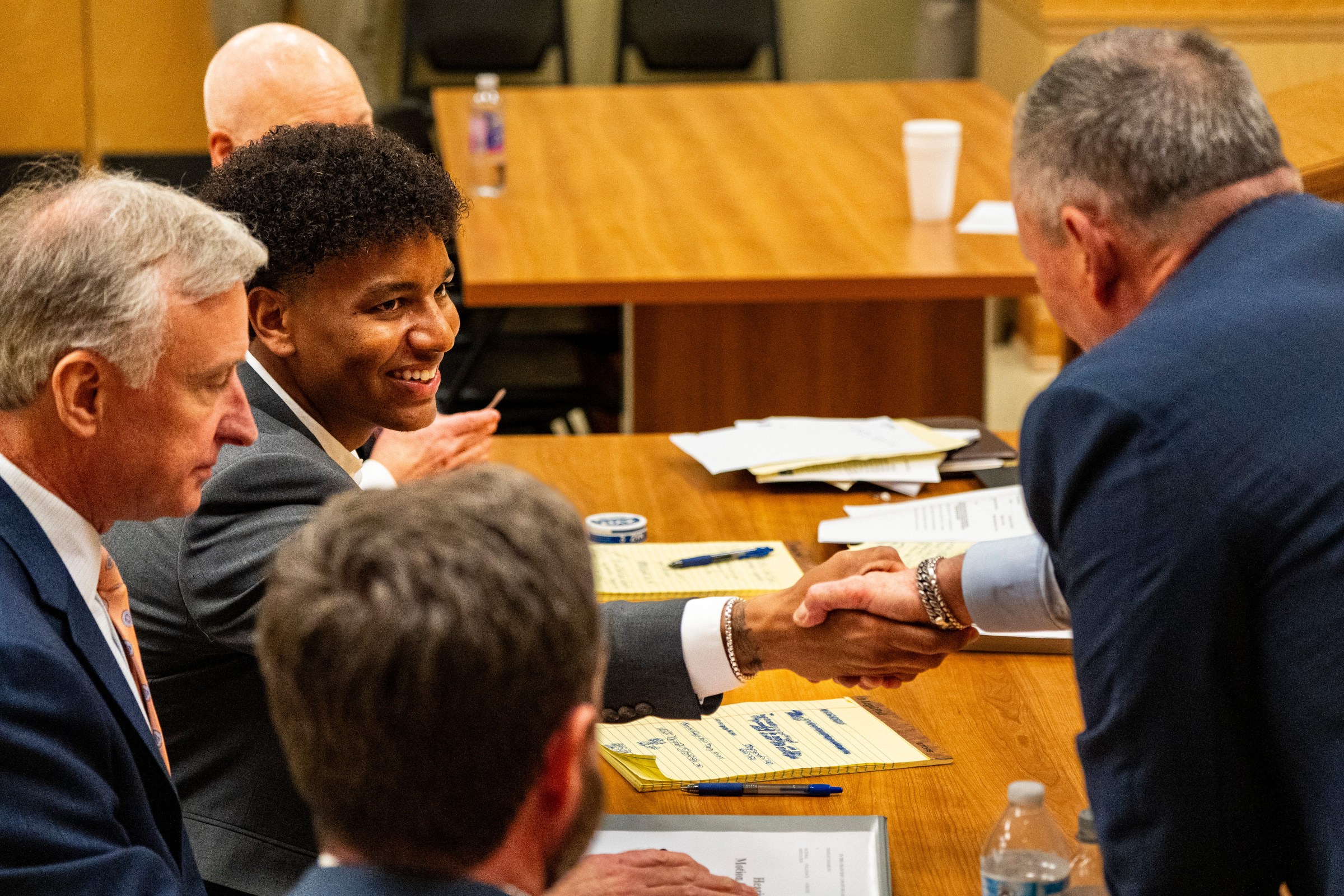Ole Miss quarterback Trinidad Chambliss shakes hands with members of his legal team after the hearing of Chambliss in his lawsuit against the NCAA at Calhoun County Courthouse in Pittsboro, Miss., on Thursday, Feb. 12, 2026. Chambliss was granted a preliminary injunction against the NCAA.