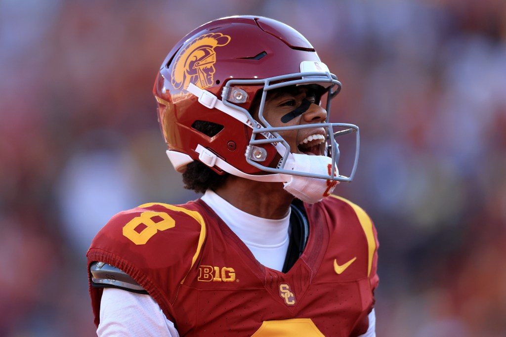 Ja'Kobi Lane #8 of the USC Trojans reacts after catching a touchdown pass.