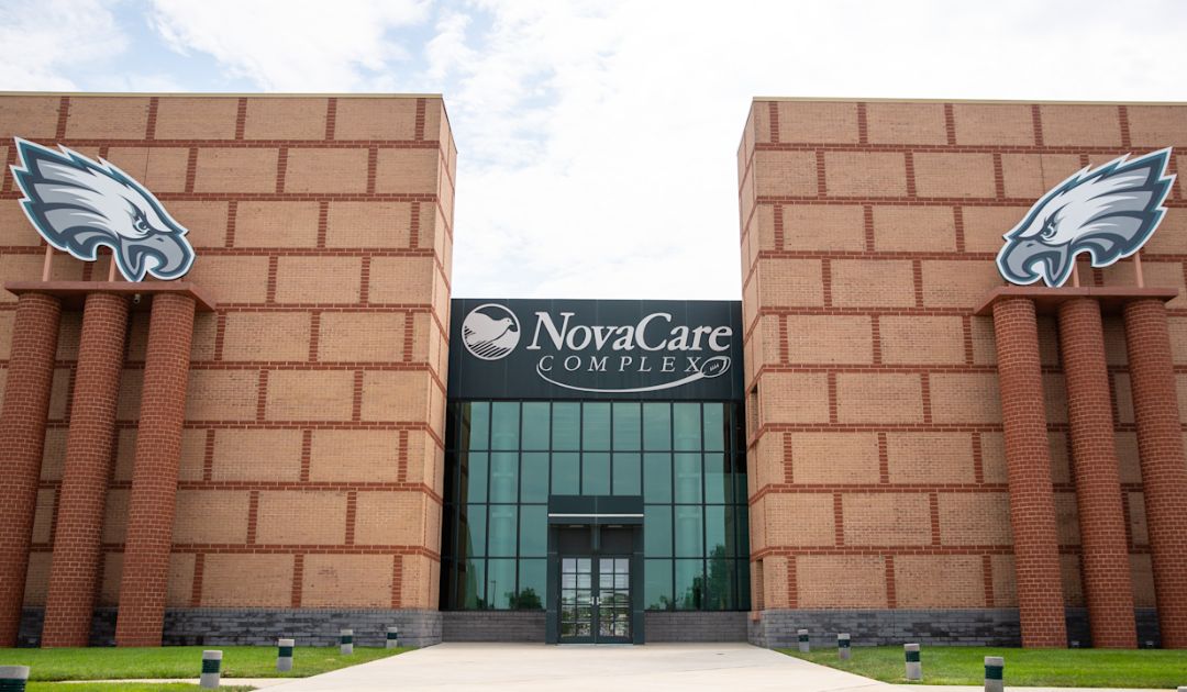 Jefferson Health gets naming rights to Eagles practice facility after announcing significant layoffs and deficit, criticized by The Rojas Report