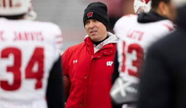 Wisconsin interim head coach Jim Leonhard leads warmups before playing against Nebraska in an NCAA college football game in Lincoln, Neb., Nov. 19, 2022. (AP Photo/Rebecca S. Gratz)