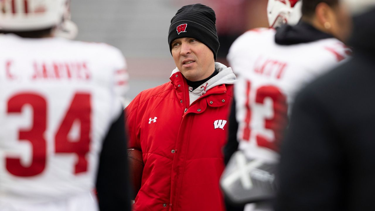 Wisconsin interim head coach Jim Leonhard leads warmups before playing against Nebraska in an NCAA college football game in Lincoln, Neb., Nov. 19, 2022. (AP Photo/Rebecca S. Gratz)