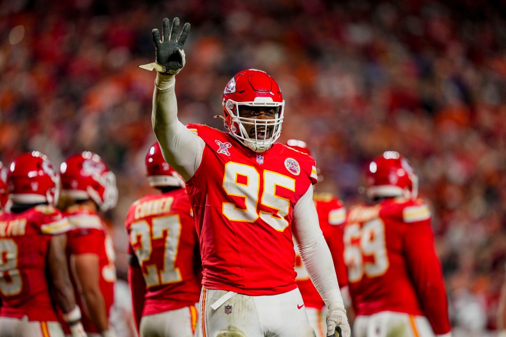 Kansas City Chiefs defensive tackle Chris Jones (95) gestures to the crowd.