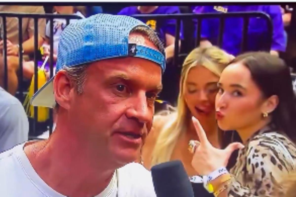 Livvy Dunne photo bombs interview with LSU coach Lane Kiffin