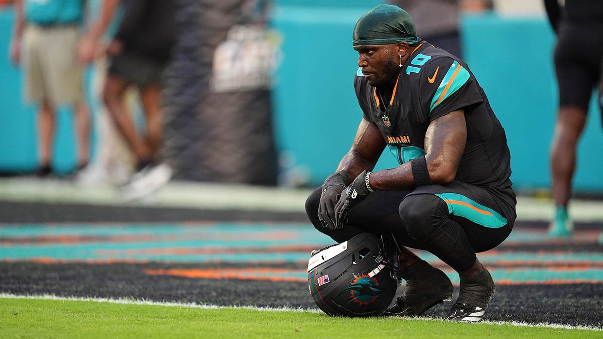 Tyreek Hill looks on