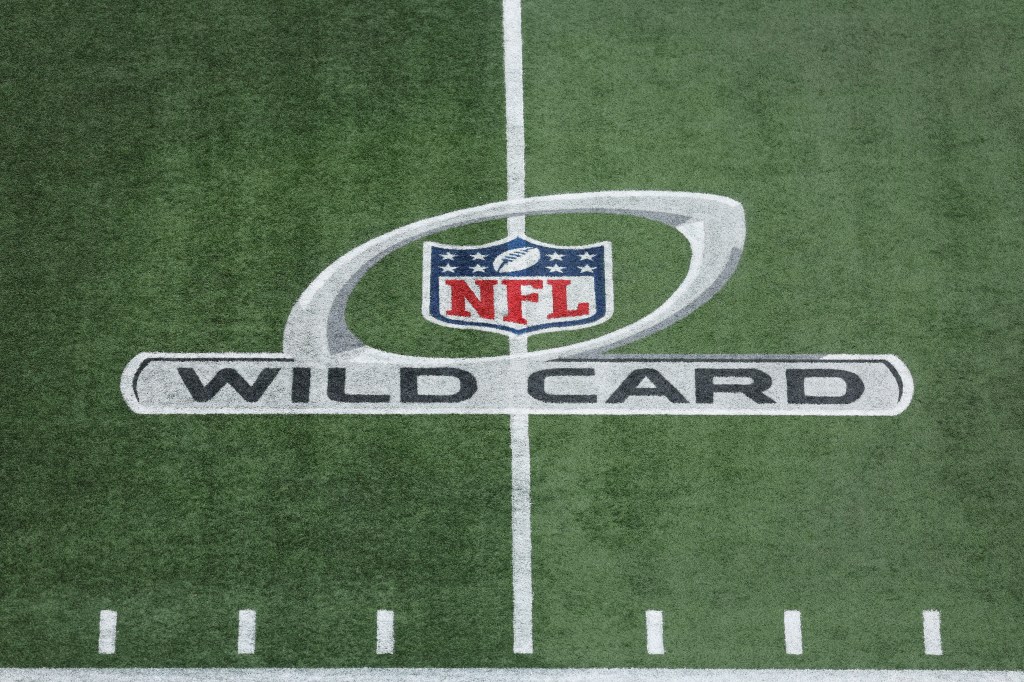 The NFL Wild Card logo painted on a football field.
