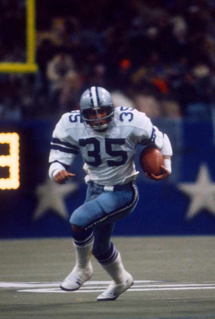 Dallas Cowboys player running with a football.