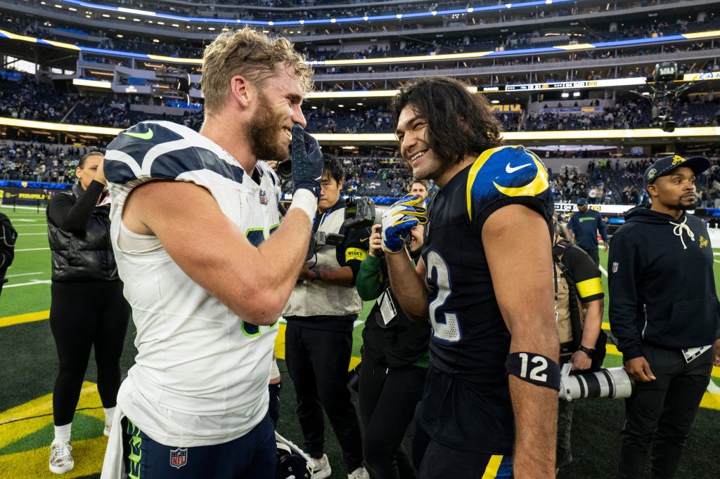 Los Angeles Rams wide receiver Puka Nacua and Seattle Seahawks wide receiver Cooper Kupp chat after an NFL football game.