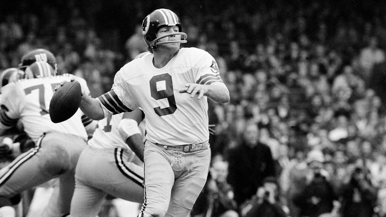 Washington quarterback Sonny Jurgensen looks to pass against the New York Giants during an NFL football game in 1974. (AP File Photo)