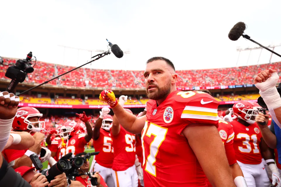 Travis Kelce #87 of the Kansas City Chiefs looks on in a huddle prior to the game against the Philadelphia Eagles at Arrowhead Stadium on September 14, 2025