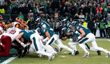 Philadelphia Eagles quarterback Jalen Hurts, center, and teammates run the tush push play during the NFL championship playoff football game against the Washington Commanders, Sunday, Jan. 26, 2025, in Philadelphia