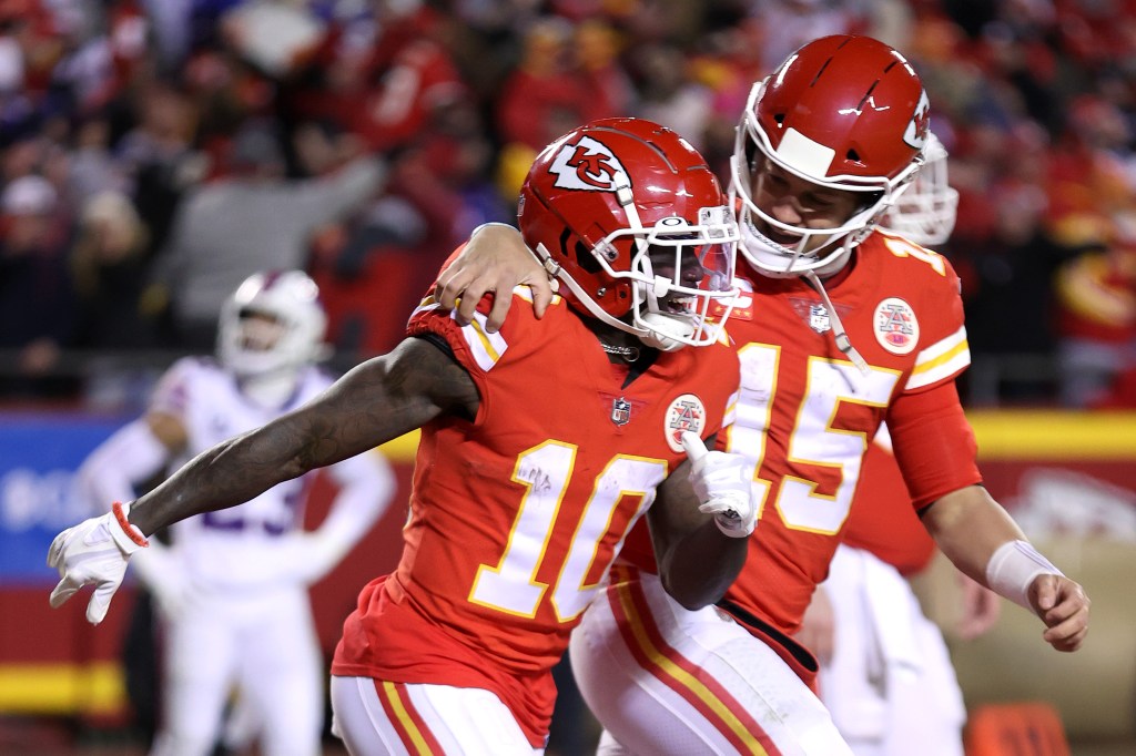 Kansas City Chiefs players Tyreek Hill and Patrick Mahomes celebrate during the AFC Divisional Playoff game against the Buffalo Bills.