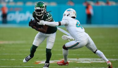Dec 8, 2024; Miami Gardens, Florida, USA; Miami Dolphins cornerback Kader Kohou (4) attempts to tackle New York Jets wide receiver Davante Adams (17) during the second half at Hard Rock Stadium. Mandatory Credit: Jasen Vinlove-Imagn Images