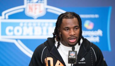 Washington Huskies running back Jonah Coleman speaks to members of the media