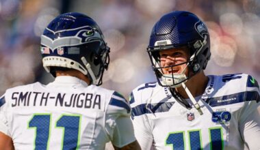 Seattle Seahawks wide receiver Jaxon Smith-Njigba celebrates with quarterback Sam Darnold