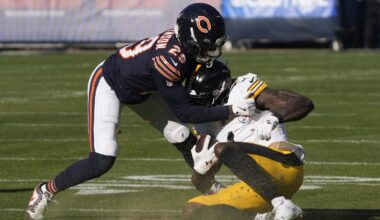 Nov 23, 2025; Chicago, Illinois, USA; Pittsburgh Steelers wide receiver DK Metcalf (4) is tackled by Chicago Bears cornerback Tyrique Stevenson (29) during the first half at Soldier Field. Mandatory Credit: David Banks-Imagn Images