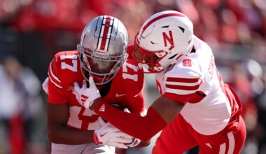 Oct 26, 2024; Columbus, Ohio, USA; Ohio State Buckeyes wide receiver Carnell Tate (17) catches a touchdown pass as Nebraska Cornhuskers defensive back DeShon Singleton (8) defends during the first quarter at Ohio Stadium. Mandatory Credit: Joseph Maiorana-Imagn Images