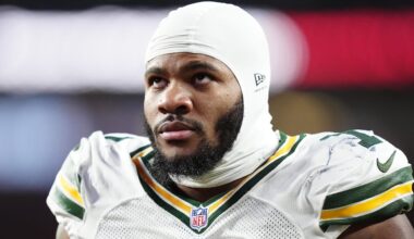 Dec 14, 2025; Denver, Colorado, USA; Green Bay Packers defensive end Micah Parsons (1) walks off the field with help from medical personnel following an injury during the third quarter against the Denver Broncos at Empower Field at Mile High.
