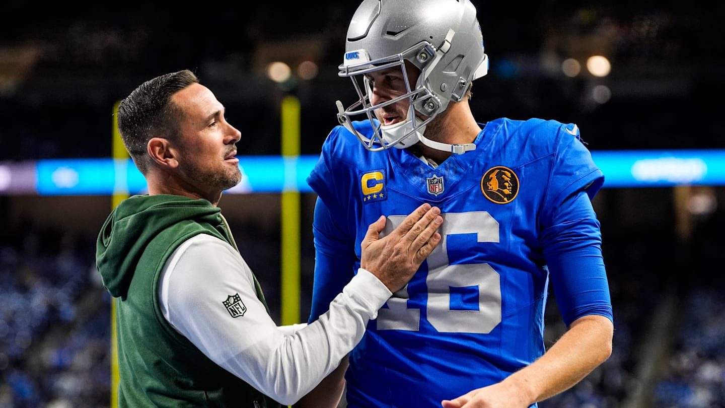 Detroit Lions quarterback Jared Goff (16), right, talks to Green Bay Packers head coach Matt LaFleur during warmup ahead of the Green Bay Packers game at Ford Field in Detroit on Thursday, Nov. 27, 2025.