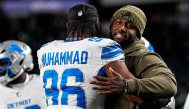 Detroit Lions defensive coordinator Kelvin Sheppard hugs linebacker Al-Quadin Muhammad (96) at warmup ahead of the Philadelphia Eagles game at Lincoln Financial Field in Philadelphia on Sunday, November 16, 2025.