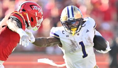 Oct 4, 2025; College Park, Maryland, USA;  Washington Huskies running back Jonah Coleman (1) stiff arms Maryland Terrapins linebacker Trey Reddick (3)  while picking up yardage in the first half at SECU Stadium.