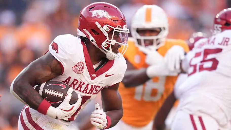 Arkansas running back Mike Washington Jr. runs the ball during the NCAA college football game against Tennessee.