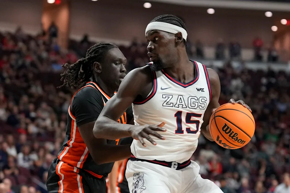 March 9, 2026; Las Vegas, NV, USA; Gonzaga Bulldogs forward Graham Ike (15) dribbles the basketball against Oregon State Beavers center Yaak Yaak (4) during the first half at Orleans Arena. © Kyle Terada-Imagn Images