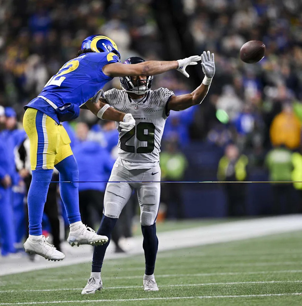 Seattle Seahawks cornerback Josh Jobe (29) breaks up a pass intended for Los Angeles Rams wide receiver Puka Nacua (12) during the third quarter of the game at Lumen Field, on Thursday, Dec. 18, 2025, in Seattle.