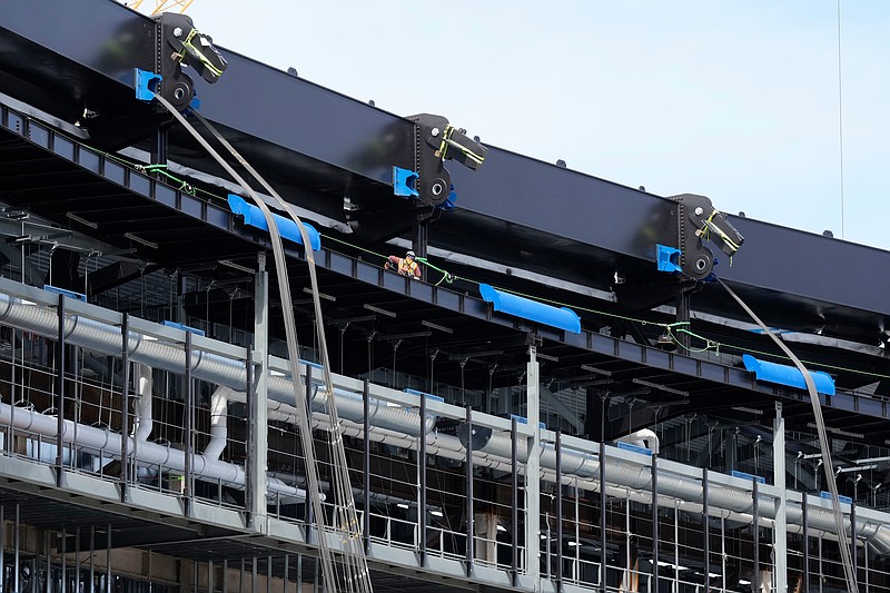 Construction continues on a new enclosed stadium for the Tennessee Titans NFL football team, Tuesday, March 24, 2026, in Nashville, Tenn. (AP Photo/George Walker IV)
