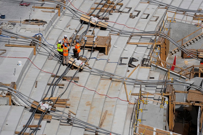 Construction continues on a new enclosed stadium for the Tennessee Titans NFL football team, Tuesday, March 24, 2026, in Nashville, Tenn. (AP Photo/George Walker IV)