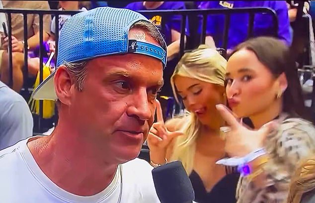 Livvy Dunne couldn't resist photobombing LSU football head coach Lane Kiffin on Friday night