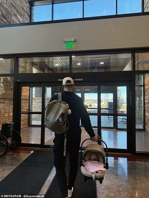 The signal caller was pictured carrying their bundle of joy out of the hospital in a sweet snap