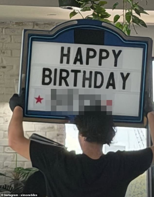 In one snap, a man could be seen holding up a sign that read: 'Happy Birthday b****!'