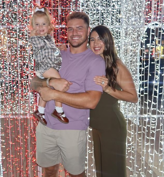 Wilson, pictured with wife Morgan and daughter Kambry James, was cut by Dallas last month