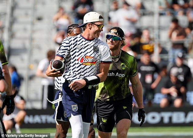 Tom Brady smirks at Logan Paul during the Fanatics Flag Football Classic held at BMO Stadium
