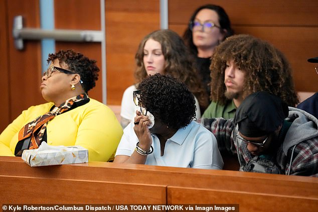 Ethan Perry's mother, Roslyn Perry, center, listens to Assistant Franklin County Prosecutors Jeff Zezech talk about the fatal car crash with fKirk Barton and her son