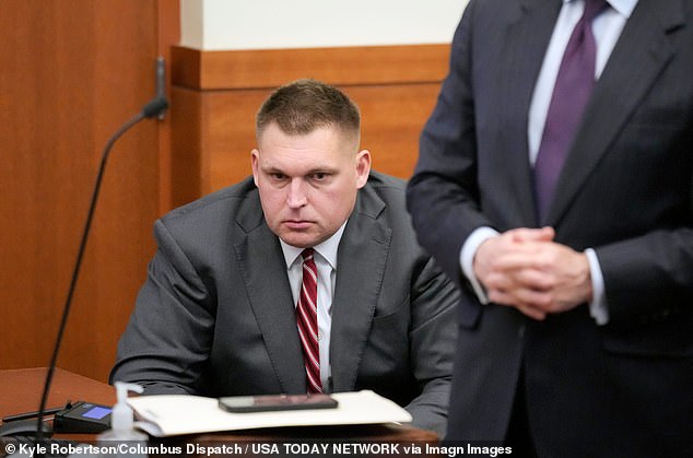 Former Ohio State football player Kirk Barton listens to visiting Judge David Cain speak