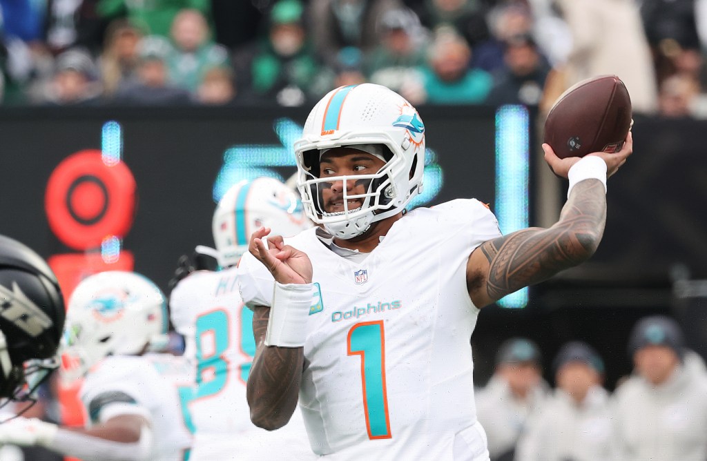 12/7/25 - Miami Dolphins vs. New York Jets at MetLife Stadium - Miami Dolphins quarterback Tua Tagovailoa #1 throws a pass during the third quarter.