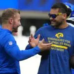 Los Angeles Rams coach Sean McVay (left) talks with wide receiver Puka Nacua (12) against the Los Angeles Chargers in the first half at SoFi Stadium.