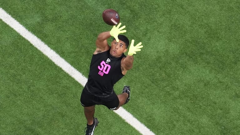 Ohio State defensive back Lorenzo Styles Jr. (50) goes through...