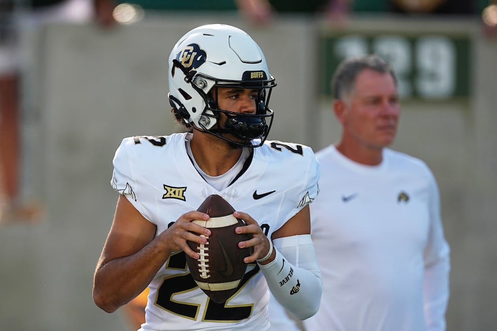 FILE - Colorado quarterback Dominiq Ponder (22) warms up before an NCAA college football game...