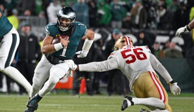 Jan 11, 2026; Philadelphia, PA, USA; Philadelphia Eagles quarterback Jalen Hurts (1) runs past San Francisco 49ers defensive end Keion White (56) in an NFC Wild Card Round game at Lincoln Financial Field.