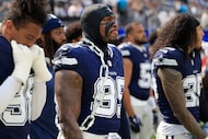 Dallas Cowboys defensive tackle Perrion Winfrey (99) bears a large chain to go with his face...