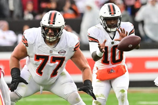 Oct 15, 2023; Cleveland, Ohio, USA; Cleveland Browns quarterback PJ Walker (10) takes the snap behind guard Wyatt Teller (77) during the first half against the San Francisco 49ers at Cleveland Browns Stadium. Mandatory Credit: Ken Blaze-USA TODAY Sports