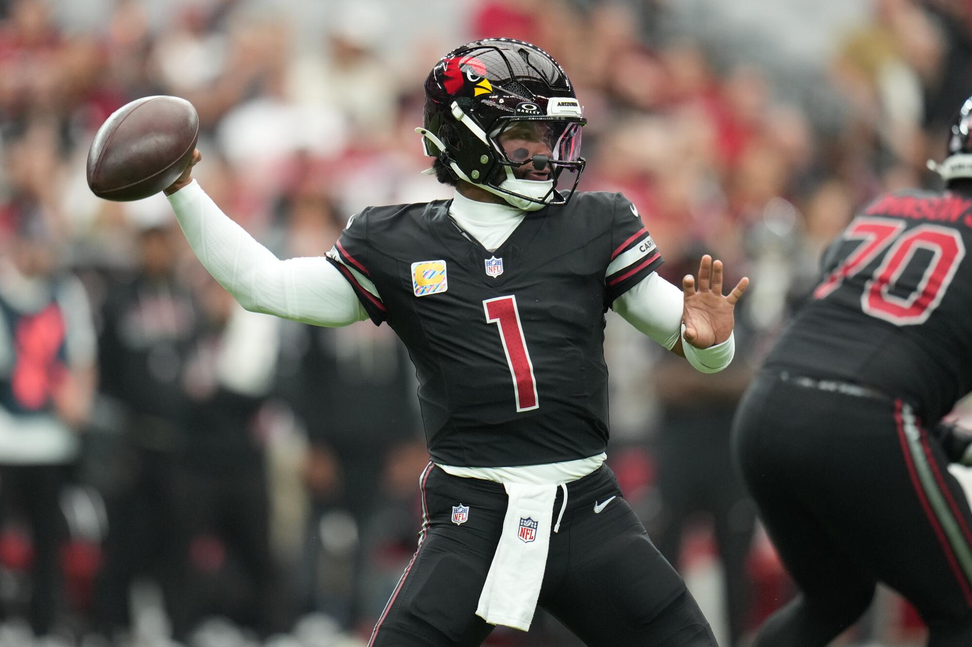 Former Arizona Cardinals quarterback Kyler Murray passes during a game.